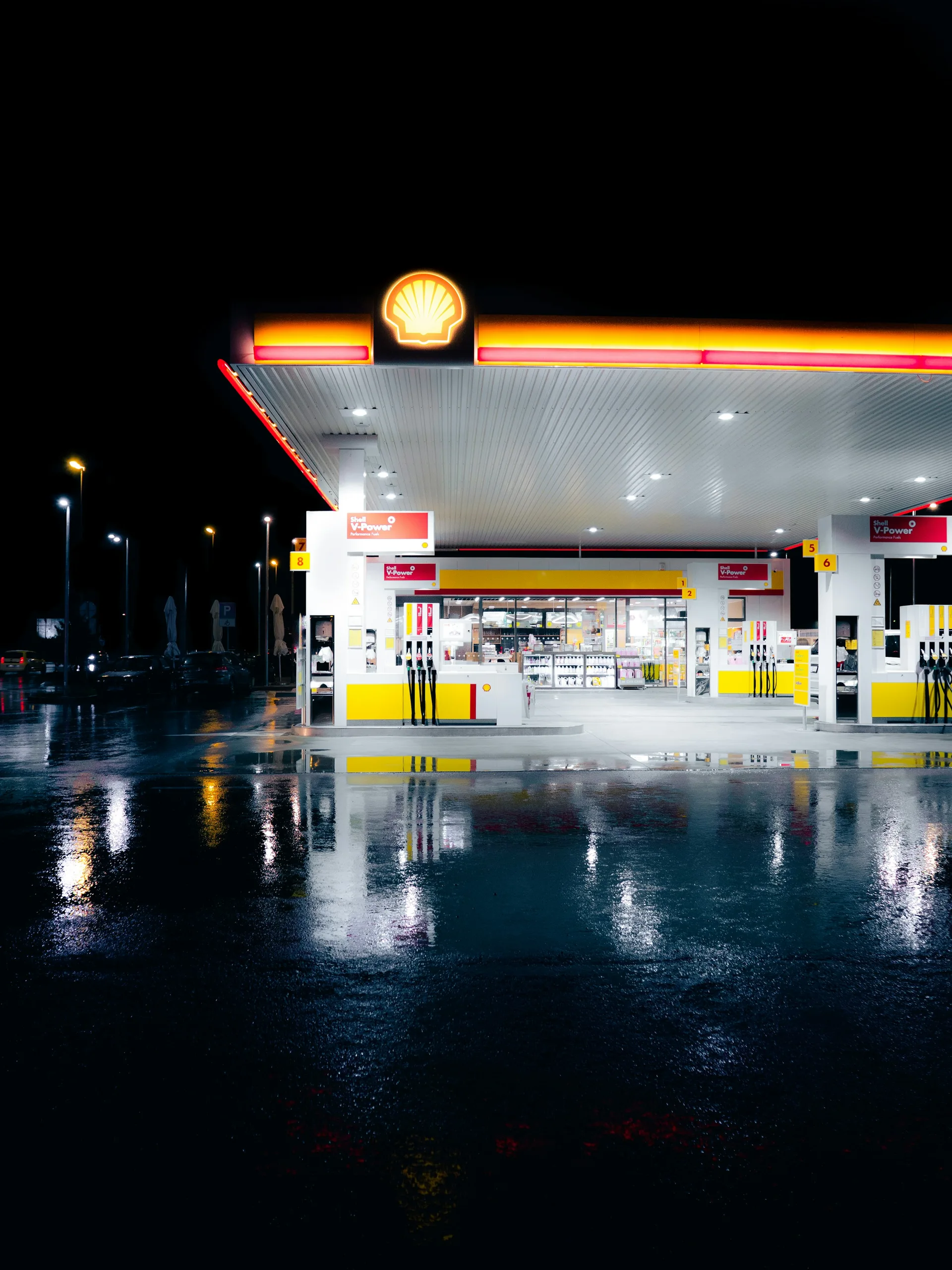 A gas station and convenience store illuminated at night